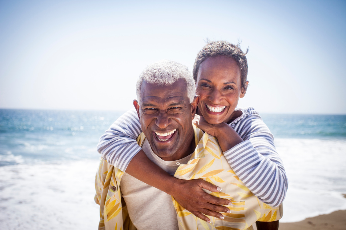 Black Couple Piggyback on Beach